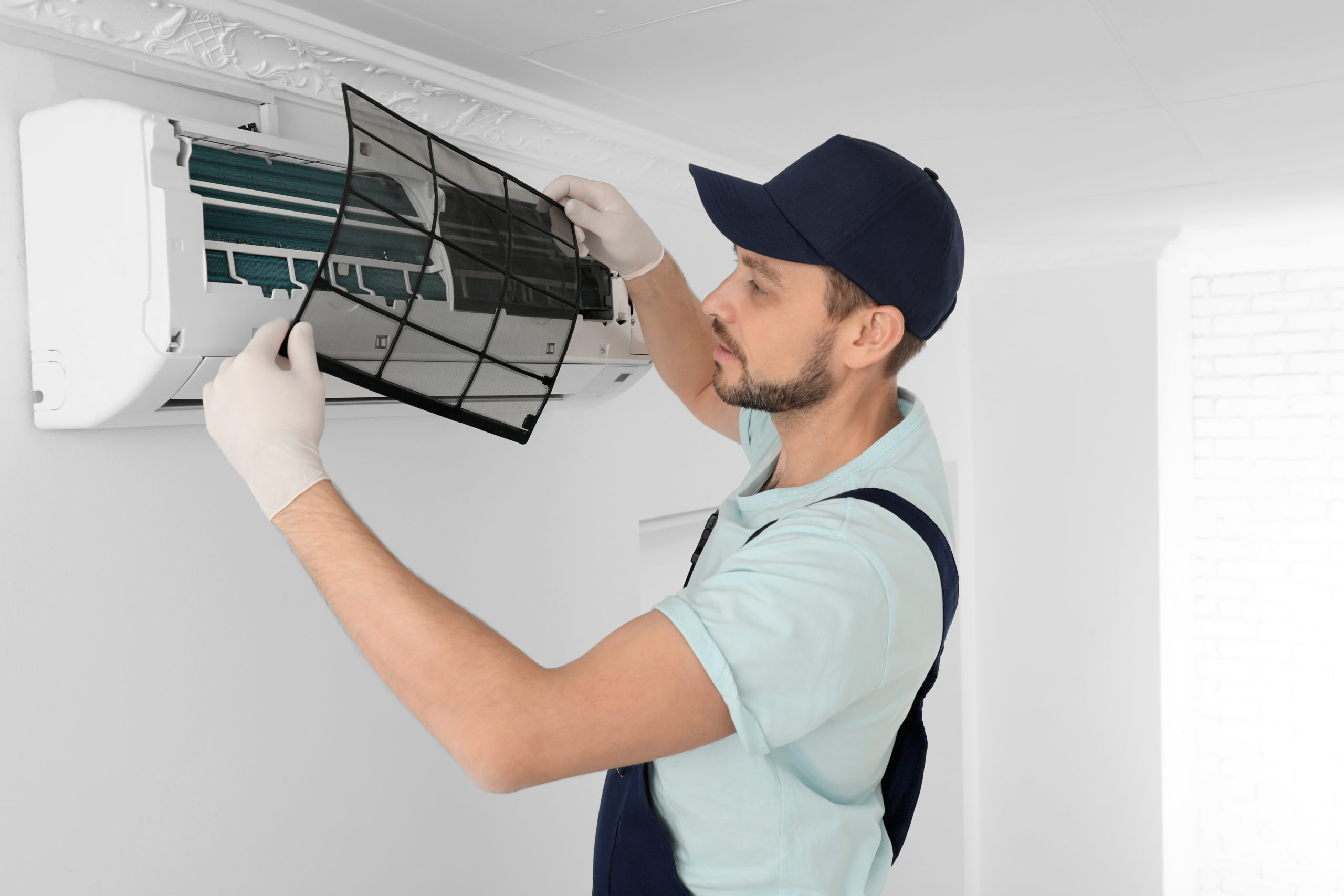 residential air conditioning experts changing AC filter